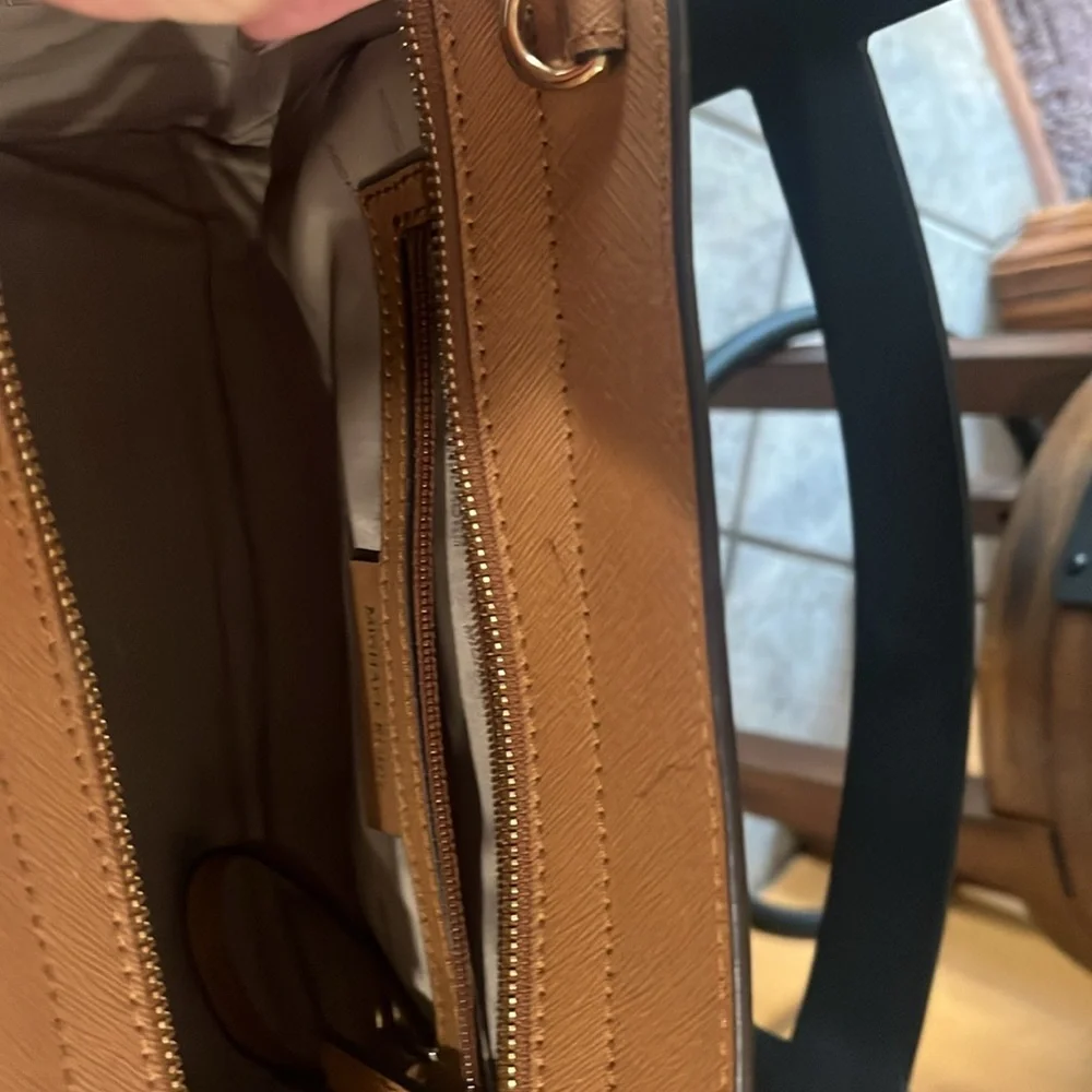Michael Kors Brown and Tan Studded Satchel
11’9 inside zipper and wristlet . - Picture 4 of 4
